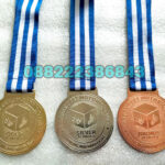 35. Harga Medali Kuningan